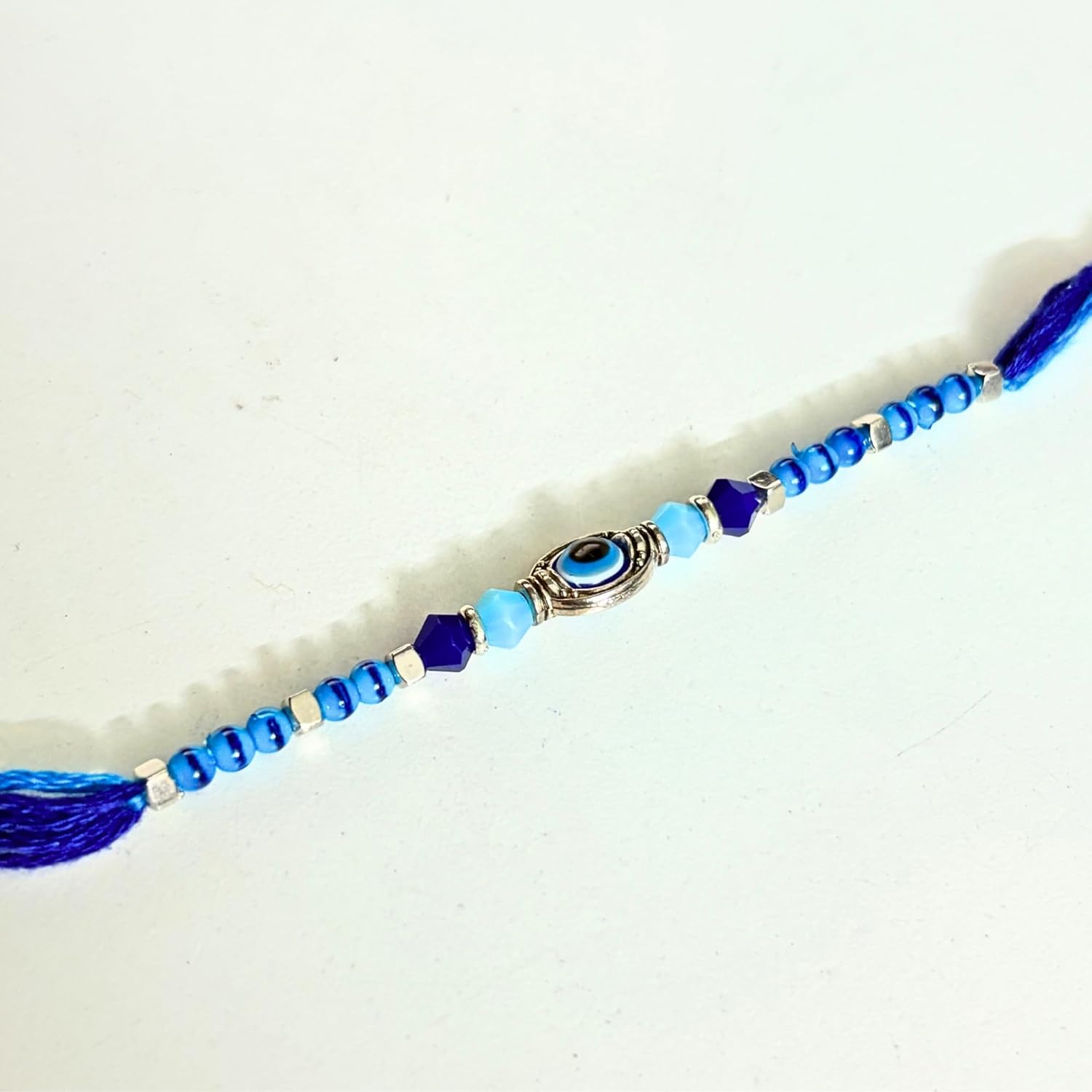 santarms Evil Eye Rakhi with Roli Chawal Vials – Blue Nazar Battu Rakhi for Boys, Men, Brother – Stylish Beaded Thread Bracelet for Raksha Bandhan - Set of 2 - Image 6