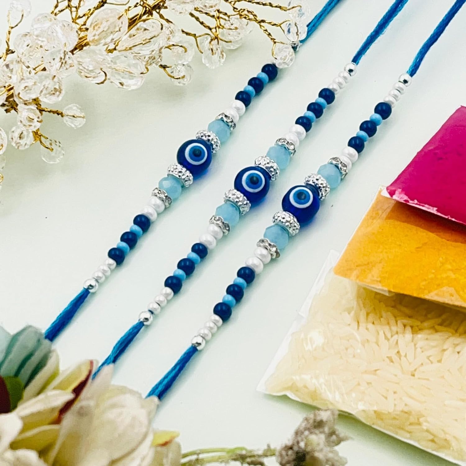 TANAIRA Traditional Rakhi Set with Evil Eye Beads, Silver Beaded Bracelets, god and Ganesh Pooja Thali Pack of 6 - Image 4