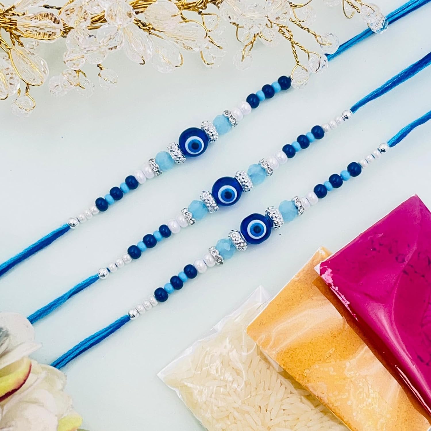 TANAIRA Traditional Rakhi Set with Evil Eye Beads, Silver Beaded Bracelets, god and Ganesh Pooja Thali Pack of 6 - Image 2