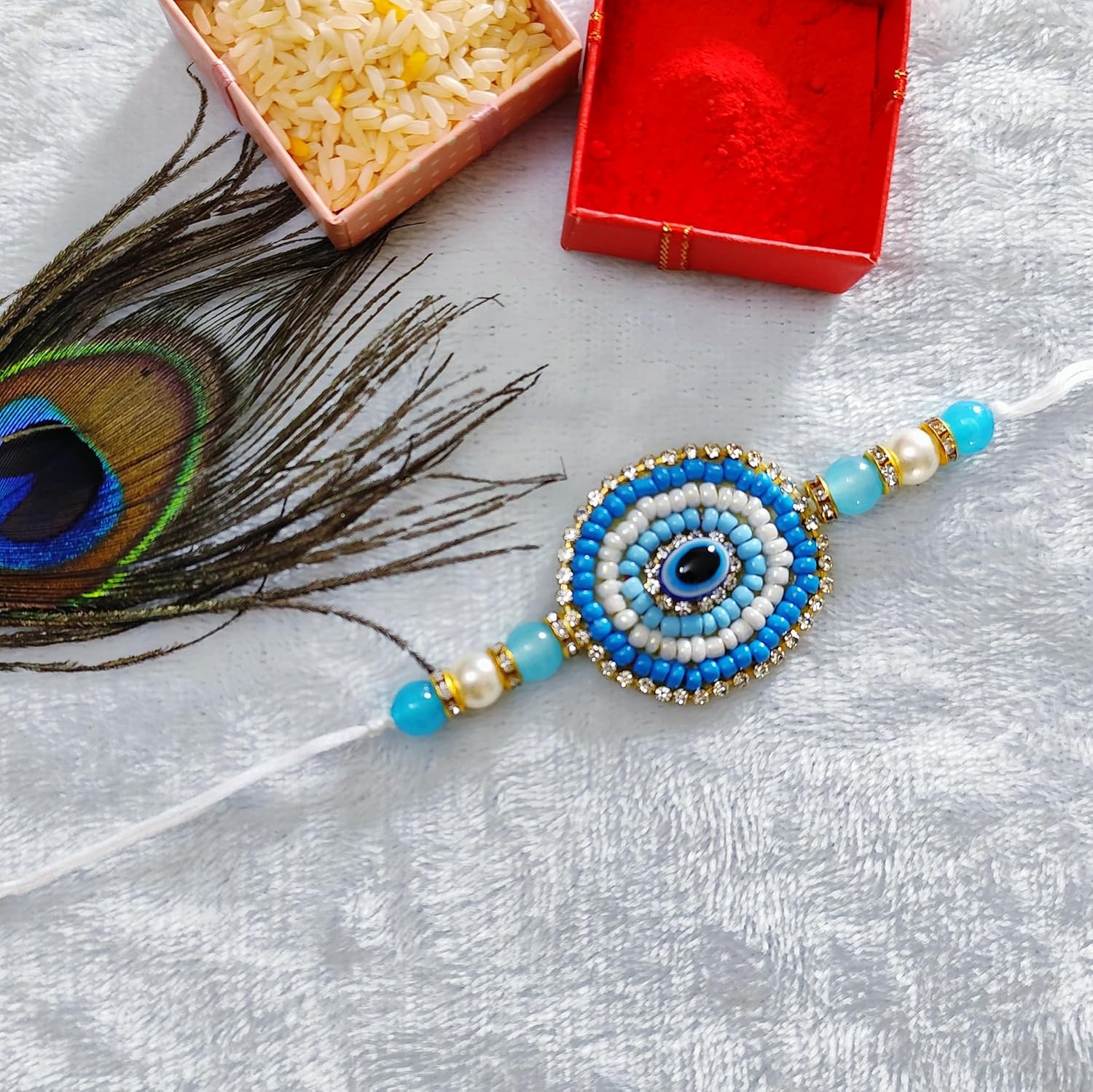 Fashion Oasis Nazar Raksha Rakhi for Bhaiya, Blue nazar raksha pearl beads beaded in Thread Rakhi Combo set with Roli Chawal for Rakshabandhan special - Image 3