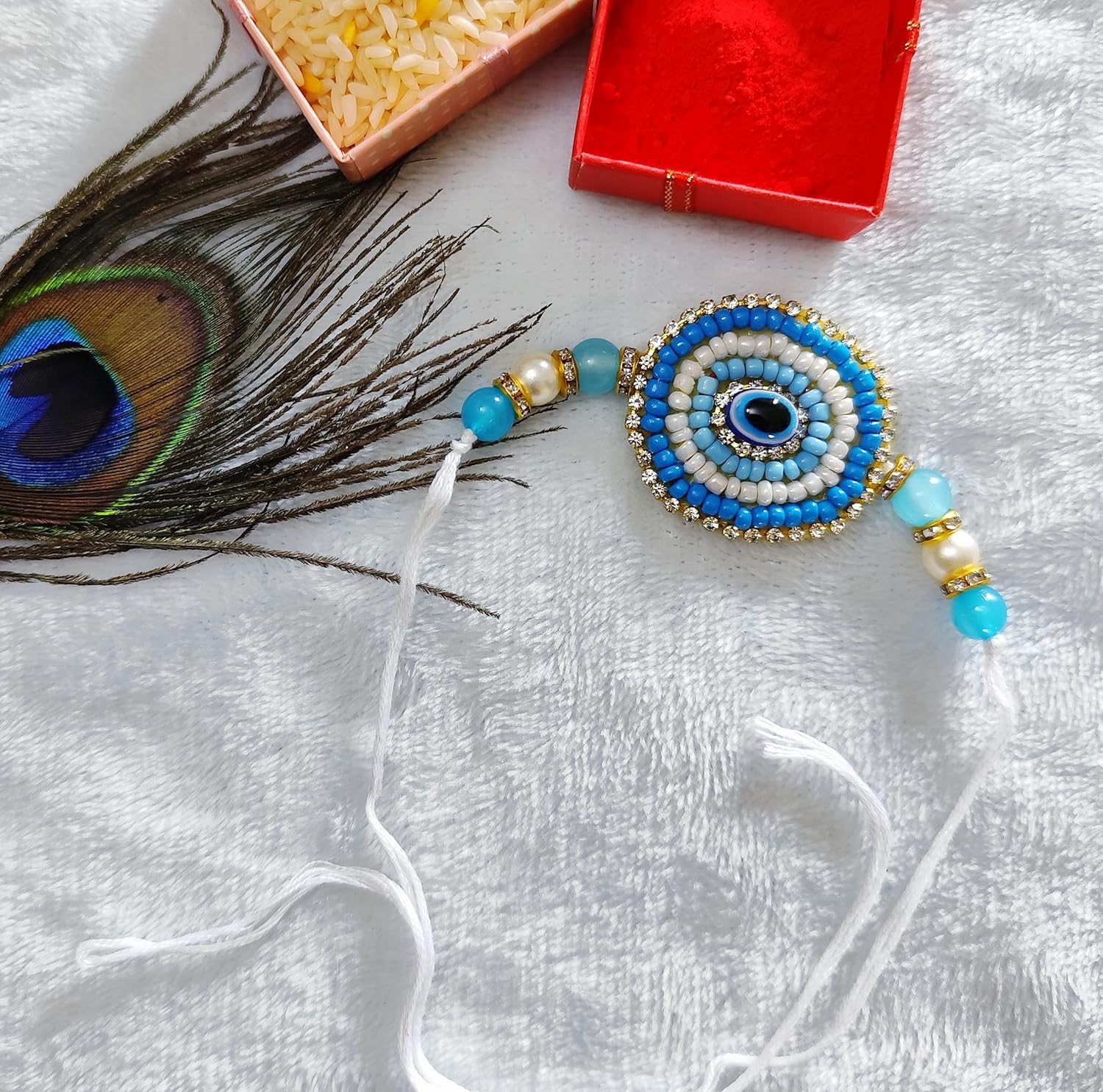 Fashion Oasis Nazar Raksha Rakhi for Bhaiya, Blue nazar raksha pearl beads beaded in Thread Rakhi Combo set with Roli Chawal for Rakshabandhan special - Image 4