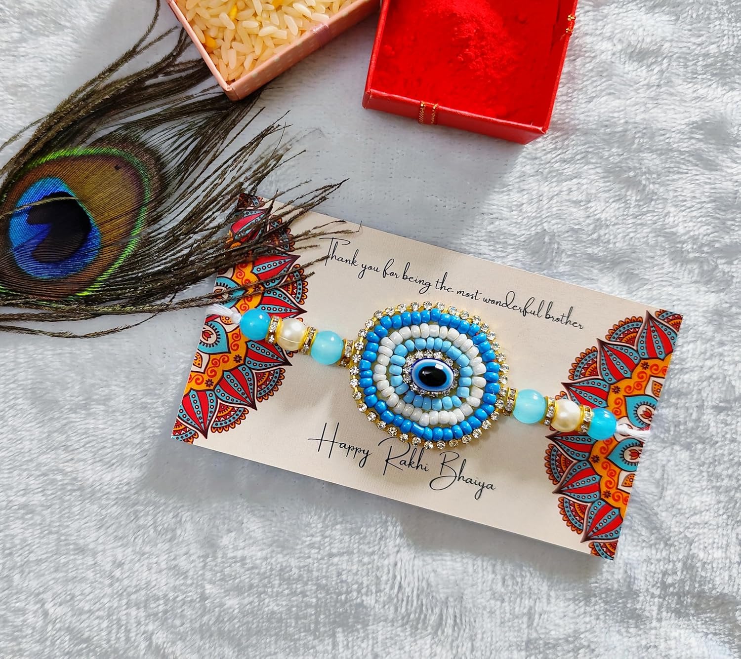 Fashion Oasis Nazar Raksha Rakhi for Bhaiya, Blue nazar raksha pearl beads beaded in Thread Rakhi Combo set with Roli Chawal for Rakshabandhan special - Image 2
