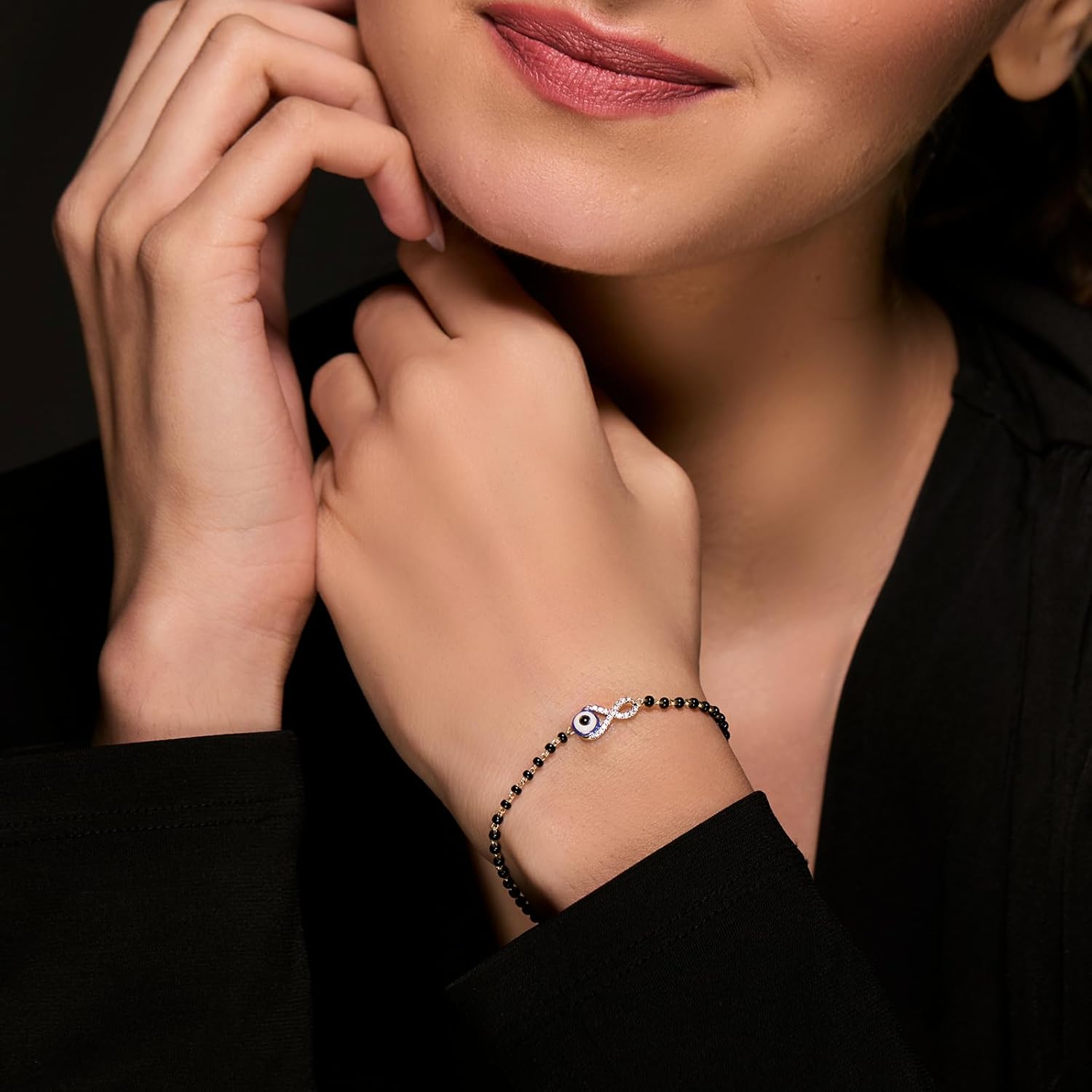 CaratLane 14 KT Yellow Gold Infinity Evil Eye Diamond Mangalsutra Bracelet for Women - Image 2