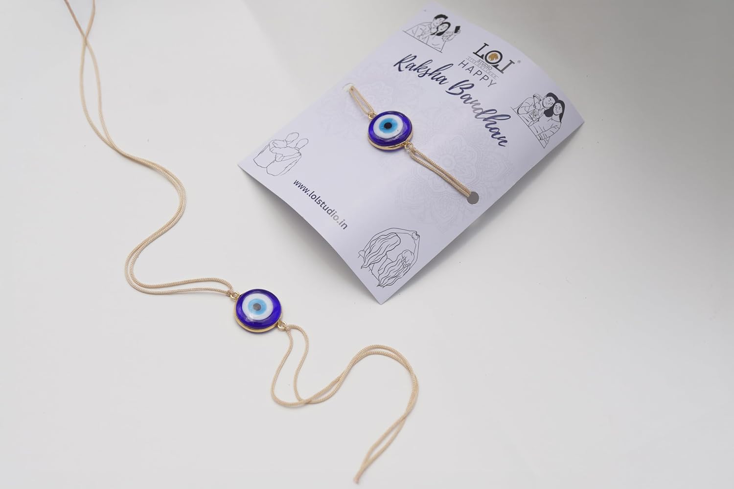 LOL STUDIO - LIVE OUT LOUD Evil Eye Rakhi with Blue Glass Pendant, Gold-Toned - Image 5