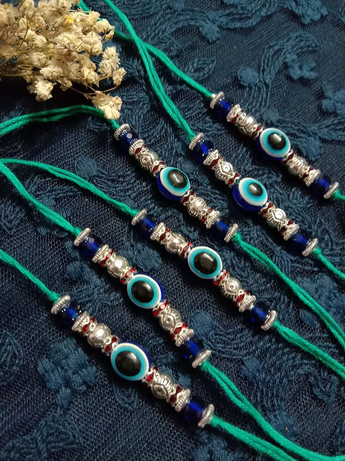 Untouched Set of 6 Designer Rakhi for Brother and Bhabhi with Artificial Blue Evil Eye Rakshabandan Bracelet - Image 3