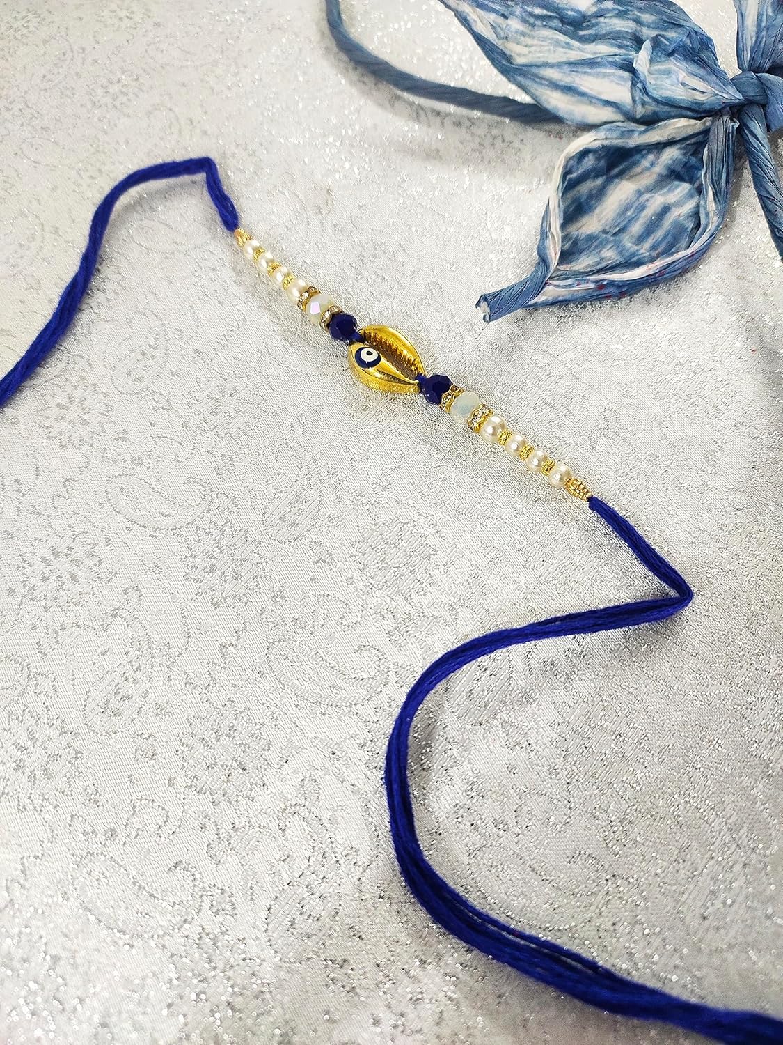 SAFFRON SHADES Sign of Prosperity Cowrie Shell Red and Blue Evil Eye Rakhi for Brother | Designer Premium Rakhi | Roli Chawal - Image 3